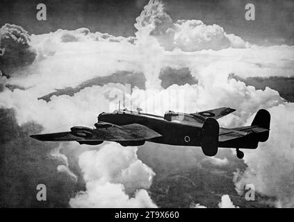 An Avro Lancaster, British Second World War heavy bomber in flight. It was designed and manufactured by Avro as a contemporary of the Handley Page Halifax, both bombers having been developed to the same specification, as well as the Short Stirling, all three aircraft being four-engined heavy bombers adopted by the Royal Air Force  during the Second World War after its introduction in February 1942. Stock Photo