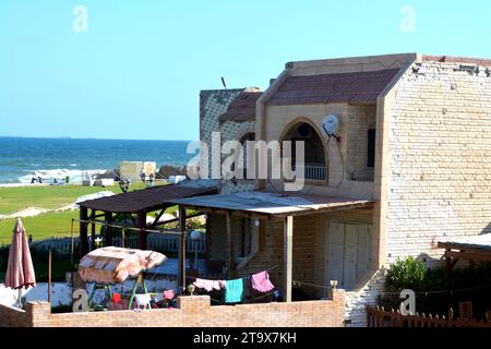 Alexandria, Egypt, September 10 2022: A Chalet villa in a resort in Alexandria on the seaside with green areas and directly on the Mediterranean Sea, Stock Photo