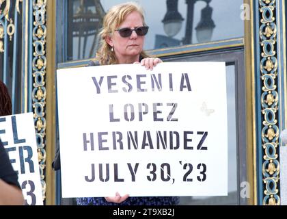 San Francisco, CA - Oct 16, 2023: Participants holding signs of recently murdered women at a Domestic Violence Awareness Month Rally outside City Hall Stock Photo