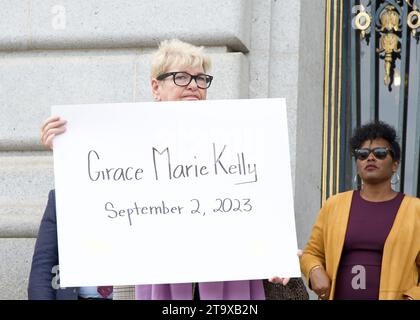 San Francisco, CA - Oct 16, 2023: Participants holding signs of recently murdered women at a Domestic Violence Awareness Month Rally outside City Hall Stock Photo