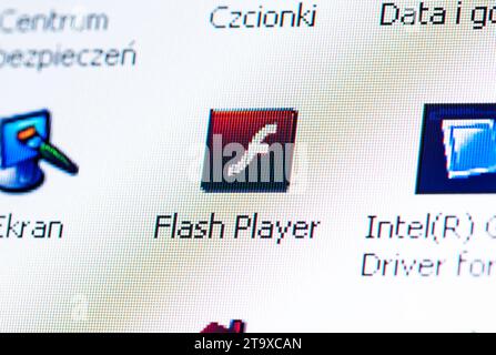 Adobe Flash Player discontinued software app logo icon symbol, obsolete technology, obsolete flash games and animations concept laptop computer monito Stock Photo
