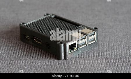 Raspberry Pi small format computer in a 3D printed protective case object closeup, nobody. Single board computers and 3d printed accessories concept, Stock Photo