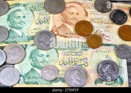 Jordanian money background of old coins and banknotes of Dinars of old times, old vintage retro Jordan money coin and bills, exchange rate, economy st Stock Photo