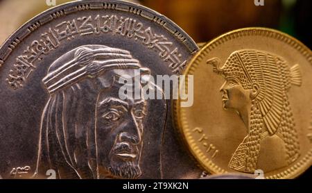 An old vintage retro silver one 1 LE EGP Egyptian pound with a bust of King Faisal Bin AbdulAziz Al Saud as a commemoration after his death, with an E Stock Photo