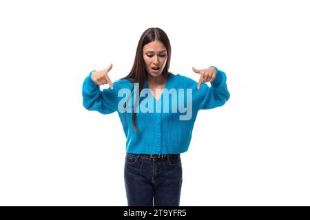 inspired successful cute young woman dressed in blue cardigan Stock Photo