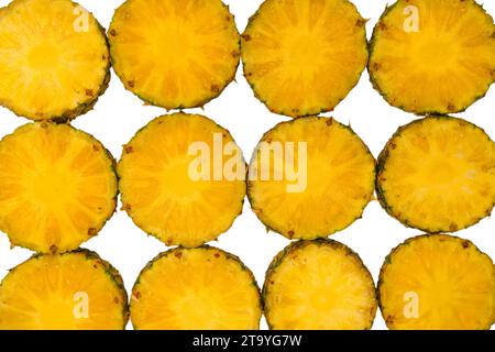 Pineapple juicy yellow slices on a white background. Top view. Stock Photo