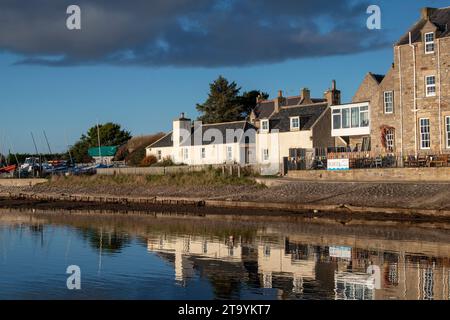 Houses along Findhorn Bay in the late afternoon November light. Findhorn, Morayshire, Scotland Stock Photo