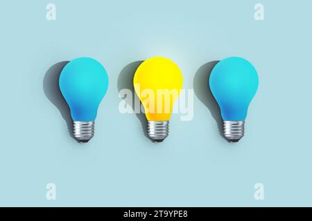 Blue light bulbs with glowing one different idea on blue background. minimal concept. top view. New Creative Idea. One yellow creative light bulb is i Stock Photo