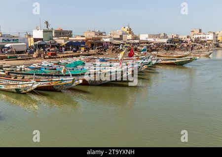 Saint Louis, Senegal: 28 January 2019 - Fishing boats resting on the riverbank of the river Senegal Stock Photo