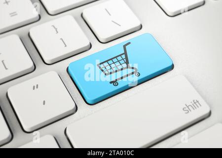 shopping cart symbol on blue button key of white keyboard, online shopping, internet shop concept Stock Photo