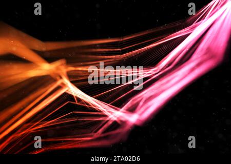 abstract stream array colorful glitter sparkle yellow, orange lines with particles  on black background science and research concept Stock Photo