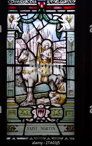 St. Martin, Martin of Tours or Martin the Merciful, Bishop of Tours, France, on Horseback. Stained glass Window in Cloisters Chester Cathedral Stock Photo