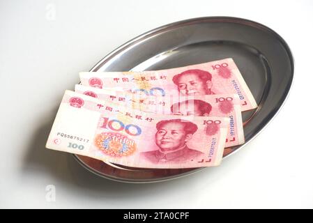 Chinese banknotes on tip tray Stock Photo