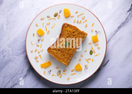 Delicious vegan carrot and tangerine sponge cake with ground almonds. Stock Photo