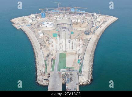 (231128) -- ZHONGSHAN, Nov. 28, 2023 (Xinhua) -- This aerial photo taken on Nov. 27, 2023 shows the west artificial island of the Shenzhen-Zhongshan link in south China's Guangdong Province. A cross-sea highway project between the cities of Shenzhen and Zhongshan in south China's Guangdong Province is one step closer to completion.   The last pouring of concrete was put in place on Tuesday, as work on the immersed tube underwater tunnel, which spans around 6.8 km, is nearing its end, said Guangdong Provincial Communication Group Co., Ltd.    The tunnel is part of a 24-km-long highway connectin Stock Photo