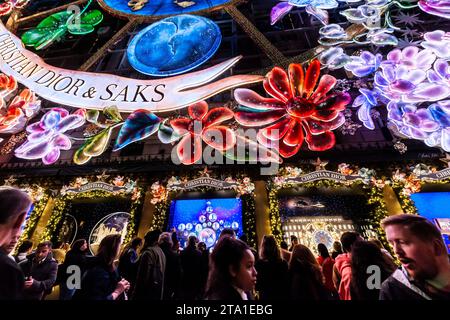 Thousands of visitors crowd Saks Fifth Avenue in New York to view their world-famous Christmas window display and Saks’ collaboration with Dior for their light show, on Wednesday, November 22, 2023 (© Richard B. Levine) Stock Photo