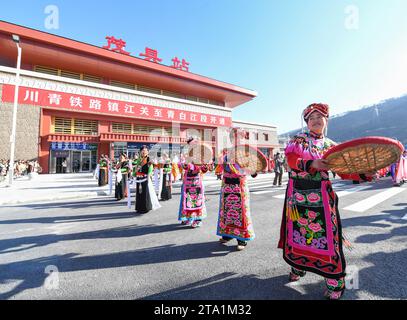 (231128) -- MAOXIAN, Nov. 28, 2023 (Xinhua) -- People celebrate the operation of a section of the Sichuan-Qinghai railway at Maoxian railway station in Maoxian County, southwest China's Sichuan Province, Nov. 28, 2023. A 238-km section of the Sichuan-Qinghai railway in western China became operational on Tuesday after 12 years of construction.   The railway crosses the rugged, earthquake-prone plateau region in northwest Sichuan, and takes a detour to avoid disturbing the Giant Panda National Park.      The Sichuan-Qinghai railway will eventually stretch northwestward to Xining, the capital ci Stock Photo