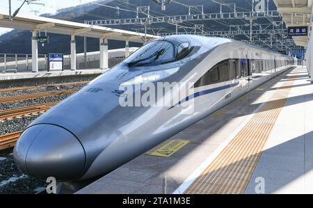(231128) -- MAOXIAN, Nov. 28, 2023 (Xinhua) -- The first high-speed passenger train C6008 arrives at Maoxian railway station in Maoxian County, southwest China's Sichuan Province, Nov. 28, 2023. A 238-km section of the Sichuan-Qinghai railway in western China became operational on Tuesday after 12 years of construction.   The railway crosses the rugged, earthquake-prone plateau region in northwest Sichuan, and takes a detour to avoid disturbing the Giant Panda National Park.      The Sichuan-Qinghai railway will eventually stretch northwestward to Xining, the capital city of Qinghai Province. Stock Photo