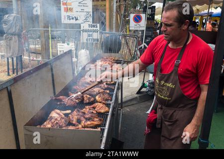 BBQ chicken seller at the public market in St-Leu, Reunion Island, France. Stock Photo