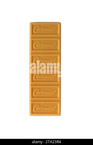 bar of Nestle Caramac chocolate unwrapped to show contents isolated on white background - looking down on from above - The Caramel Flavour bar Stock Photo