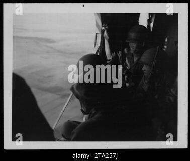 ARVN (Army of the Republic of Vietnam) soldiers, including Vietnamese marines, engage in military activities during the Vietnam War. The photo captures a moment from July 26, 1962, showcasing the involvement of the ARVN forces in the conflict. Stock Photo