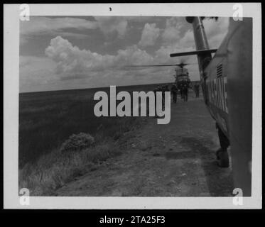 ARVN soldiers, including Vietnamese marines, are seen in this photograph taken in 1962. The soldiers belong to YP 78, a unit of the Army of the Republic of Vietnam. Their presence highlights the active military activities during the Vietnam War. Stock Photo