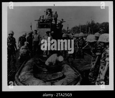 ARVN soldiers, including Vietnamese Marines, participate in military operations conducted in 1962 during the Vietnam War. This photo captures the presence and activities of the Army of the Republic of Vietnam alongside American forces. Stock Photo