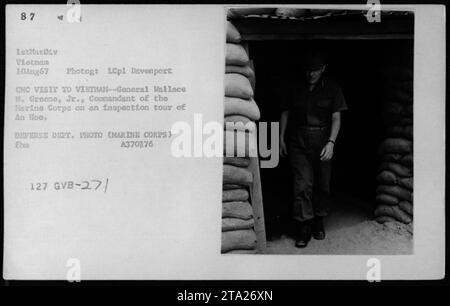 Hubert Humphrey, Gen William Westmoreland, and Sen Harry F. Byrd visit Vietnam on August 10, 1967. The photograph shows General Wallace M. Greene Jr., Commandant of the Marine Corps on an inspection tour of An Hoa. The image is part of a collection of American military activities during the Vietnam War. The photo is labeled A370376 127 GVB-27/ by the Defense Department. Stock Photo