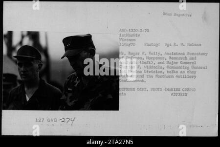 Assistant Secretary of Defense, Roger P. Kelly, and Major General Charles F. Widdecke, Commanding General 1st Marine Division, discussing as they tour the Northern Artillery Centonement during their visit on May 15, 1970. Photo taken by Sgt R. W. Maison. Department of Defense photograph (Marine Corps). Stock Photo