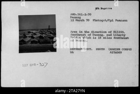 Aerial view of USMC and Vietnamese structures, including buildings and bunkers, taken on March 12, 1970. The photograph is marked as 327 GVB-327 AMD-761-2-70 Danang 12 March 70 24 Negative. It was captured by L/Cpl Pearson in the area towards H11155, located southwest of Danang, and depicts Liberty Bridge situated approximately 15 miles southwest of Danang. This image is a defense department photo from the Marine Corps. Stock Photo