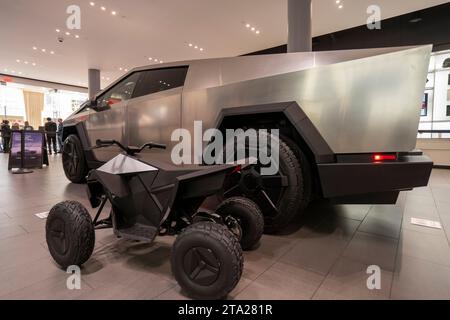 Tesla Cybertruck is displayed together with the Cyberquad for kids at the Tesla showroom in San Jose's Santana Row on Friday, November 24, 2023. Stock Photo