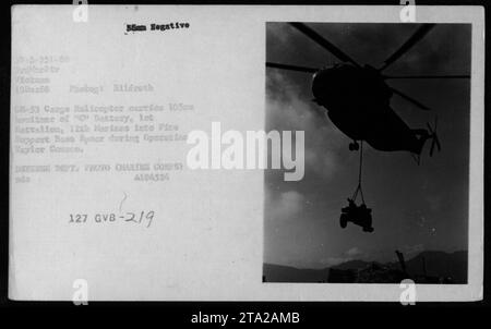 Helicopter CH-53, belonging to the US Marine Corps, is seen transporting 'C' Battery of the 1st Battalion, 12th Marines to Fire Support Base Spear during Operation Taylor Common in Vietnam. The photo, taken on December 19, 1968, captures the heavy-duty cargo helicopter carrying 105 soldiers. DEFENSE DEPT. PHOTO (MARINE CORPS) A194524. Stock Photo