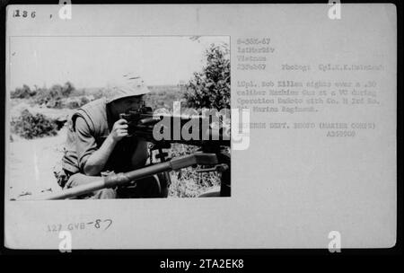 Marine LCpl. Bob Killen aims a .50 caliber machine gun at a suspected Viet Cong during Operation DeSoto. The photo was taken on February 25, 1967, by Cpl. K.K. McIntosh. Killen was a part of Co. M, 3rd Ba. 7th Marine Regiment, operating within the 1st Marine Division in Vietnam. Stock Photo