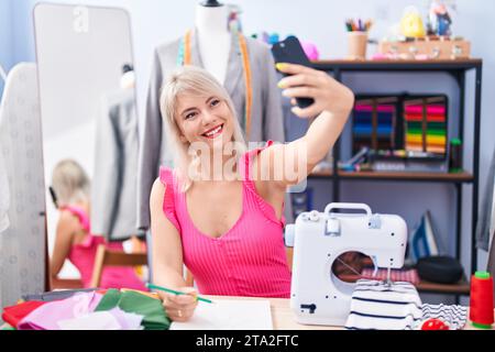 Young blonde woman tailor smiling confident make selfie by smartphone at gaming room Stock Photo