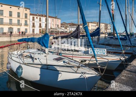 Marseillan, France - December 30, 2018: Pleasure boat docked in the small port of Marseillan on a winter day Stock Photo