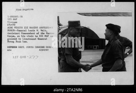 Lt Gen Lewis W Walt, Assistant Commandant of the Marine Corps, is greeted by Lieutenant General Hoang Xuan Lam during his visit to III MAF in Vietnam on November 1, 1970. This photograph captures a moment of official interaction between American and Vietnamese military officials during the Vietnam War. Stock Photo