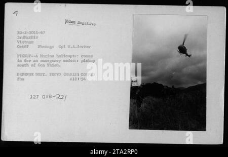 A Marine helicopter performs an emergency medevac pickup mission near Con Thien in South Vietnam, October 1967. The UH-1 helicopters are captured in action as they airlift injured personnel. This photograph is part of the collection documenting American military activities during the Vietnam War. Stock Photo