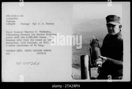 Major General Charles F. Widdecke, Commanding General 1st Marine Division, poses with a 6,000,000 round of mortars on May 15, 1970. The general will fire the round at 1st Battalion, 11th Marines, at Hill 270, located 5 miles southwest of Da Nang. Photograph by Cpl J. A. Gentry. Department of Defense photo (Marine Corps). Stock Photo