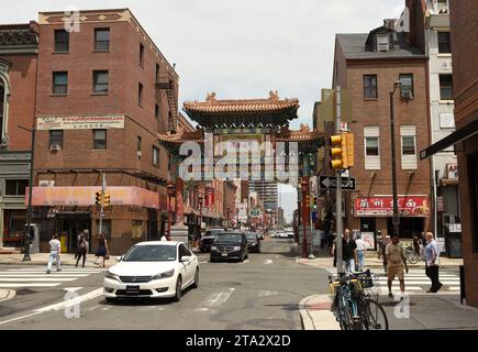 Philadelphia, USA - May 29, 2018: People and cars in Chinatown in Philadelphia, PA, USA. Stock Photo