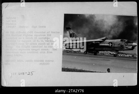 'F-8E Crusader launching on a scramble mission to support US Marine ground forces. The photo was taken on March 12, 1967, by SSgt Brown of Marine All Weather Fighter Squadron 232. During the mission, the Crusader targeted three different areas resulting in five enemy kills. Image taken in Vietnam during the Vietnam War.' Stock Photo