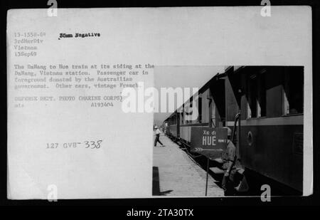 'The Dalang to Hue train stationed at DaNang, Vietnam, on September 13, 1969. The photograph showcases a passenger car in the foreground donated by the Australian government, while the other cars depict vintage French design. This image captures a part of American military activities during the Vietnam War. (Source: Defense Department Photo, Marine Corps, A193404)' Stock Photo