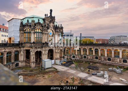 Dresden Zwinger palace king inner courtyard under reconstruction and renovation with dramatic sunset sky background. German architecture landmark Stock Photo