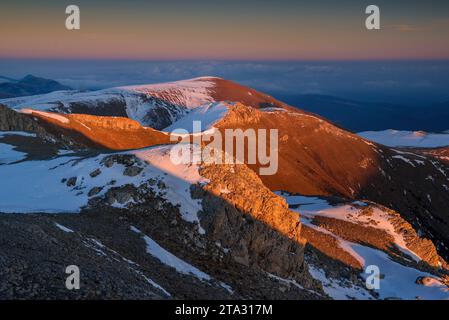 Sunset from the summit of the snowy Tosa d'Alp in winter looking towards the Puigllançada (Cerdanya, Catalonia, Spain, Pyrenees) Stock Photo