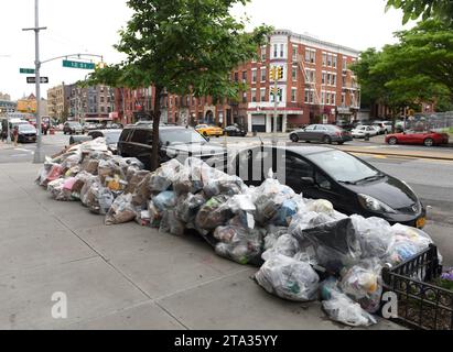 New York, USA - May 30, 2018: Garbage in bags on the street of Brooklyn in New York. Stock Photo