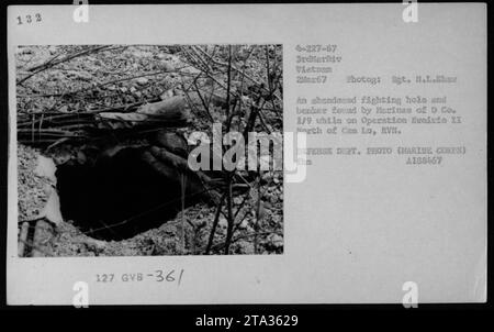 Marines of D Co. 1/9 during Operation Frairie II discovered an abandoned fighting hole and bunker, north of Can Lo, RVN on March 2, 1967. This photo, taken by Sgt. H.L. Show, captures a moment of military activity during the Vietnam War. Stock Photo