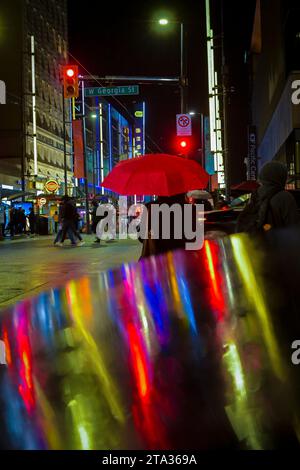 Rainy night, intersection, Granville and Georgia, downtown, Vancouver, British Columbia, Canada Stock Photo