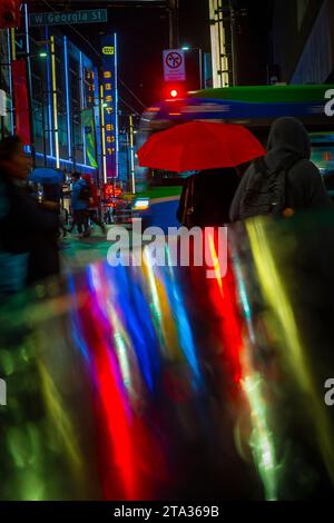 Rainy night, intersection, Granville and Georgia, downtown, Vancouver, British Columbia, Canada Stock Photo