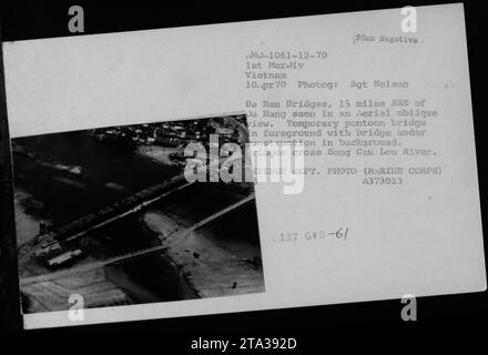 Aerial view of bridges located 15 miles SSE of Da Nang, Vietnam. The photograph, taken on April 10, 1970 by Sgt Nelson Ba Ren, shows a temporary pontoon bridge in the foreground, with a bridge under construction in the background. These bridges span the Song Cau Lou River. EFENSE DEPT. PHOTO (MARINE CORPS) A373023 127 GWB-6/70. Stock Photo