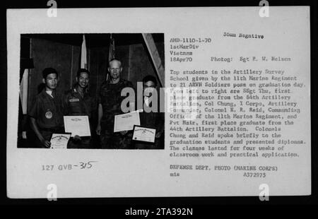 Top students in the Artillery Survey School, given by the 11th Marine Regiment to 21 ARVN (Army of the Republic of Vietnam) soldiers, pose for graduation day. The photograph shows SSgt Thu, the first-place graduate from the 64th Artillery Battalion, Col. Chung, I Corps Artillery Commander, Col. K.R. Reid, the Commanding Officer of the 11th Marine Regiment, and Pvt Hair, the first-place graduate from the 44th Artillery Battalion. The graduation ceremony included remarks and diploma presentations by Colonels Chung and Reid. The program lasted for four weeks and included both classroom work and p Stock Photo