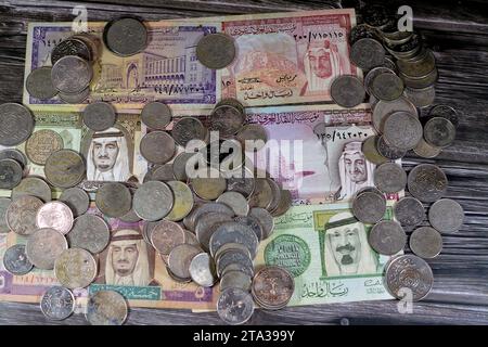 Saudi Arabia riyals money banknote bills and coins of different eras from the kingdom of Saudi Arabia times, vintage retro old Saudi currency, value, Stock Photo